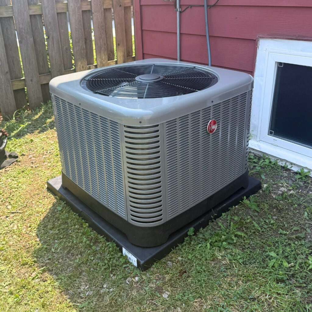 Outdoor air conditioning unit precision installation on a protective pad by SD Tech HVAC experts
